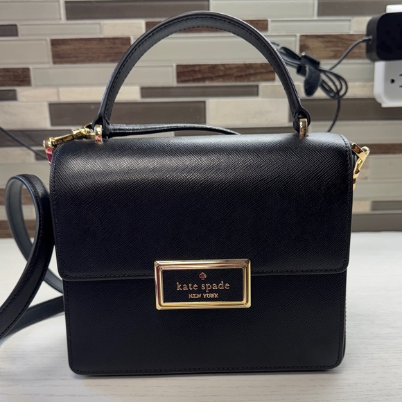 kate spade Handbags - Kate Spade Reegan Top Handle Black Crossbody Bag with Gold Accents